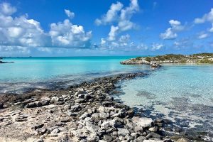 Located on Andros Island, a beach with rocky shores and clear blue water is easily accessible with daily flights from Makers Air to the Bahamas.