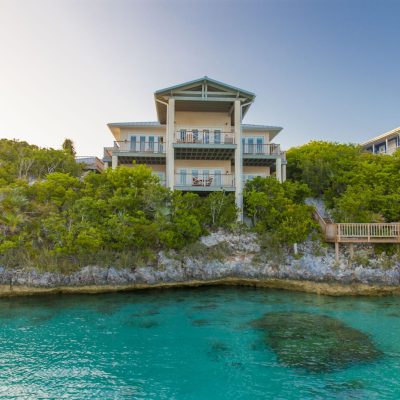 a-house-on-top-of-a-cliff-overlooks-the-ocean-in-andros-bahamas-scaled-400×400