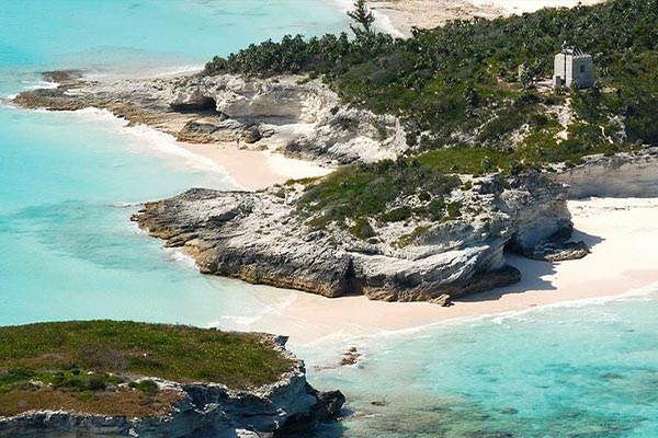 an-aerial-view-of-staniel-cay-an-island-with-turquoise-water-and-white-cliffs
